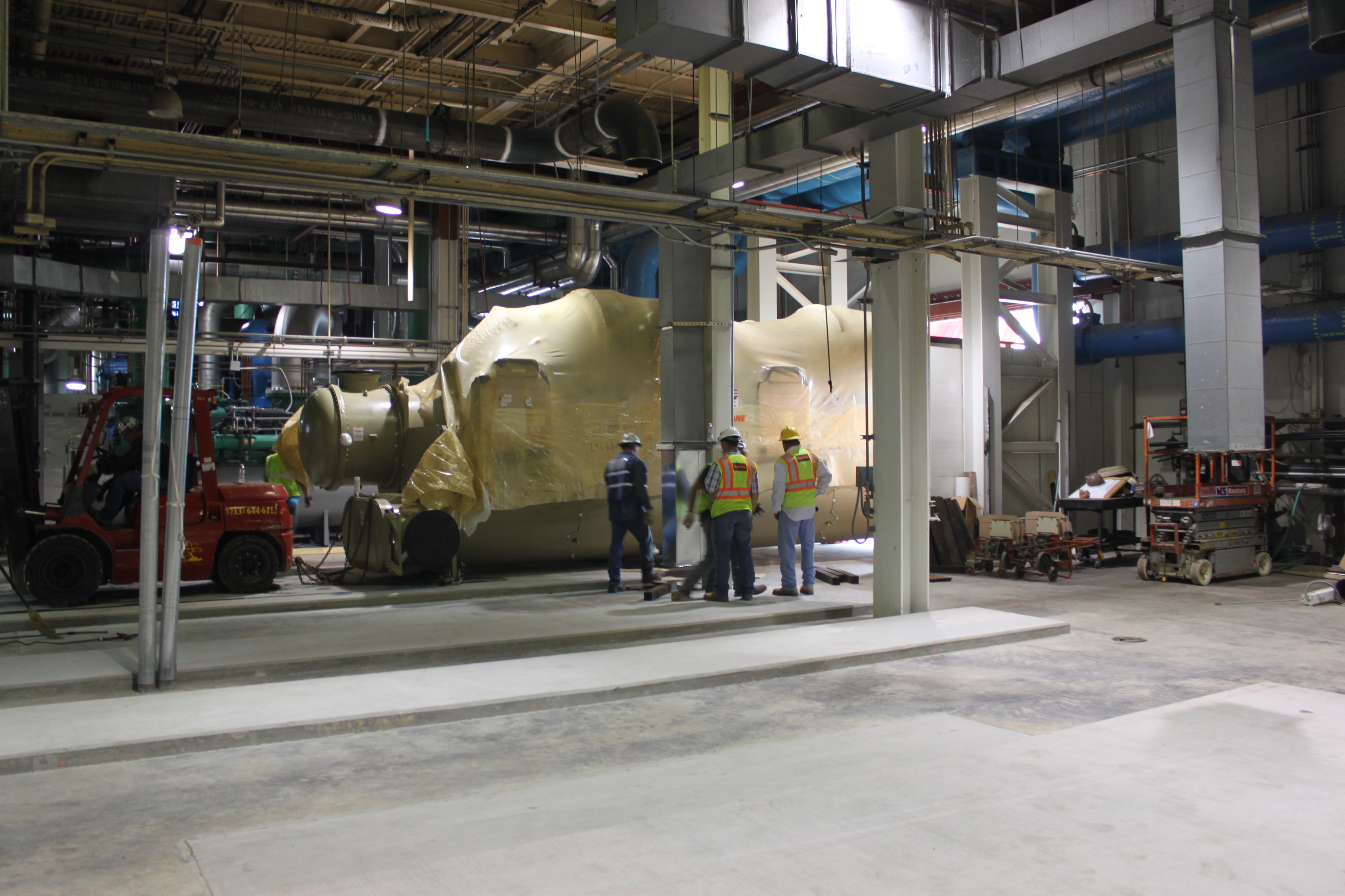 Derryberry's mechanical team setting large chillers at a project site