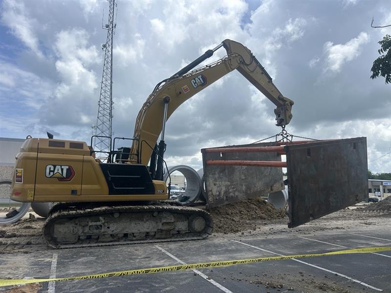 Site utility construction with excavation equipment